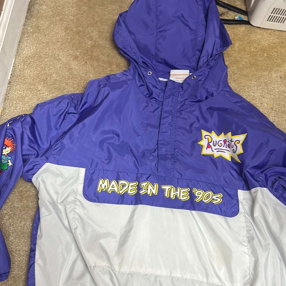 90s rugrat windbreaker with character sleeves and 1 jumbo pocket